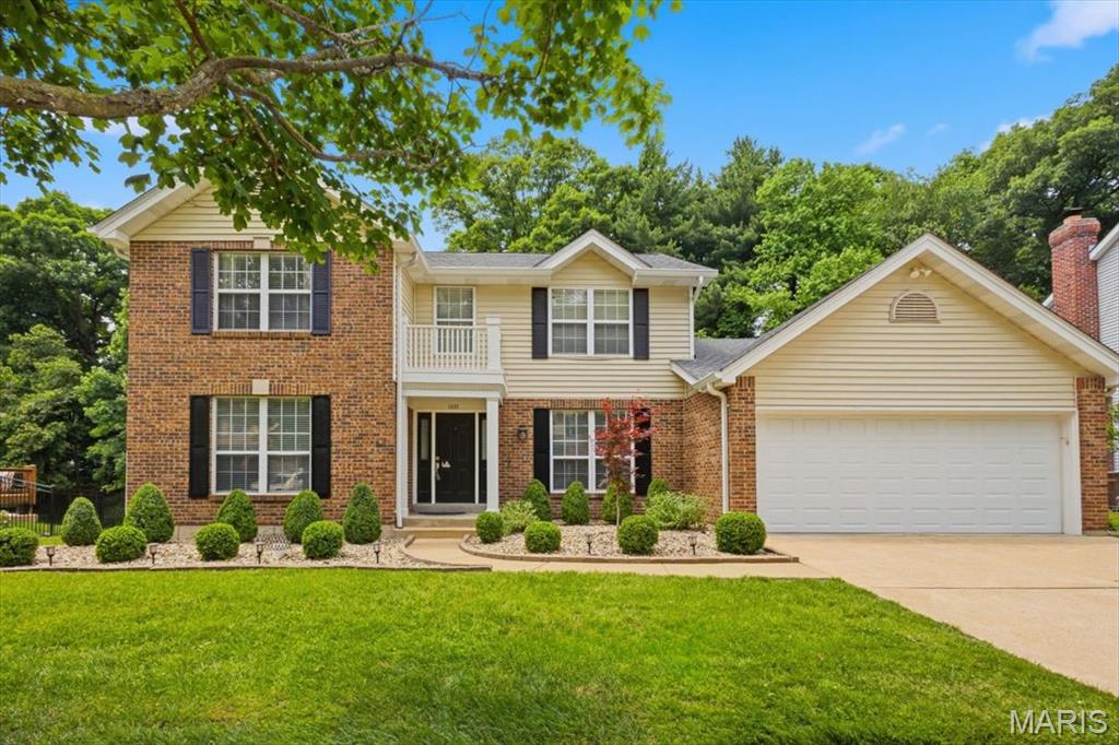 Beautiful 2-story home, located on a cul-de-sac, with a partially finished lower level, partially covered spacious deck (32x13) and in-ground heated pool.  Passed Ellisville occupancy inspection.  Roof (2024), carpet for both staircases (2023), painting of walls/ceilings/pillars (2025-2026).  Attractively landscaped and backs to trees for privacy.  Four bedrooms and 2.5 bathrooms with 3,042 sq. ft. of finished living space.  Flowing layout and abundance of natural light throughout.  The 2-story foyer opens to the living room/office, with atrium doors, and the formal dining room.  Gleaming hardwood floors and crown molding throughout most of the main level.  The light-filled family room features a brick gas fireplace, flanked by shelving on both sides, bay window and office nook, with a wall of shelves, adjacent to the family room.  Adjoining breakfast area leads into the kitchen.  The kitchen features center island, electric cooktop, double ovens (2023), refrigerator (2020), dishwasher (05/2026), 2 pantries and garden window.  Main floor laundry room, off of the kitchen, with shelves/cabinets.  Seamless indoor/outdoor flow to the large deck and pool that offers a great area for entertaining and relaxing family time.  The spacious primary bedroom, with a luxurious bathroom, skylight and walk-in closet, and 3 additional bedrooms are located upstairs.  Ceiling fans in 3 of the bedrooms.  Partially finished lower level has recreation/game areas and plenty of storage.  Oversized 2-car garage with door leading to the backyard.  AAA rated Rockwood Schools.  Convenient location to shopping/restaurants, schools and highways.