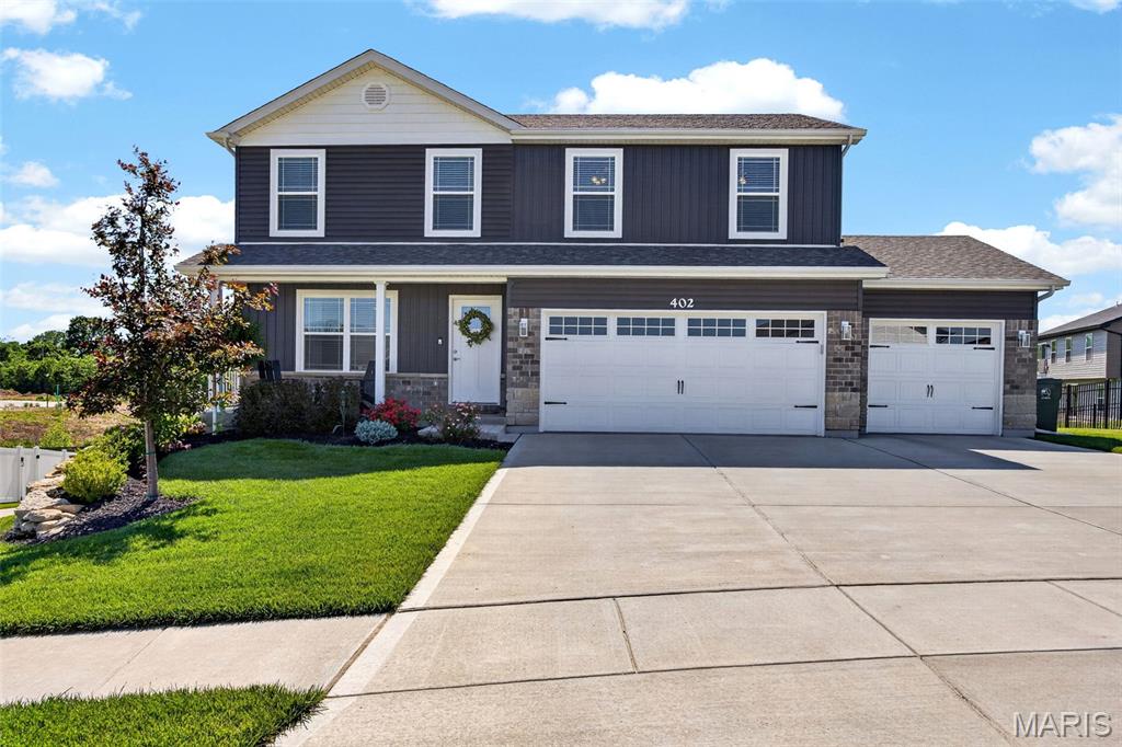 Back on the Market - Buyer couldn't get financing! Inspections done and ready to go! Will SELL FAST again! Talk about CUTE!!! This gorgeous 2 year old 5 bedroom, 3.5 bath home with beautiful curb appeal has it all! Gorgeous landscaping, 3 car garage with an extra deep 3rd car bay (21 feet deep - enough to fit your full size 4 door truck!) with 3 car wide drive way, and backing to common ground with all the privacy you could ask for, this home is a MUST SEE! You'll notice gorgeous LVP flooring and taller trim with upgraded doors with lever handles throughout, rounded corners on drywall, and 2 inch blinds throughout the main level! You'll enter into the spacious great room open to the beautiful kitchen with 42" cabinets, beautiful quartz countertops, nice size island with extra storage on both sides, undermount sink, and can lights in both the kitchen and the breakfast area. Walk out to the HUGE composite deck with vinyl rails & aluminum spindles overlooking the very large backyard with no neighbors behind you - EVER!  Large room off breakfast area, currently used as a formal dining room, could also be a great office or even a playroom for the kids! Head upstairs to find all your bedrooms - primary bedroom has a vaulted ceiling and large bath with separate tub and shower, adult height vanity, a linen closet, and nice size primary closet with motion activated lighting! Laundry room is upstairs (talk about convenient!) next to the full bath and the other 3 nice size bedrooms with sliding closets and ceiling fans! Head downstairs to the newly finished lower level to find nice carpet, taller baseboards, and nice trim along the ceiling for a beautiful finishing touch! Enjoy relaxing and playing in the family room and the 5th bedroom is right down the hall! A full bathroom with a walk in shower finishes out the basement, and you can head out into your beautiful backyard with an oversized patio! This home is in a great location, has all the finishes, and great size for your family! It won't last long!