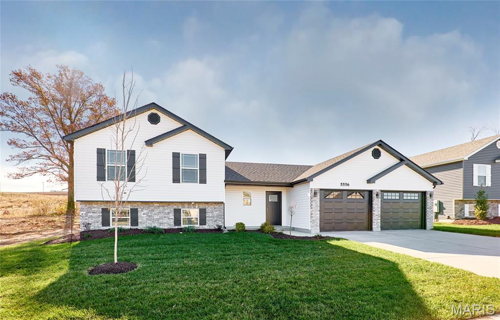 BRAND NEW home with every option you could imagine! They include vaulted ceilings, rounded “bullnose” corners, granite or quartz countertops, stainless steel appliances, 42" cabinets with "cushion close", custom neutral-colored paint job throughout, LVT flooring throughout most of the home, framed windows, taller baseboards, adult-sized cabinets in bathrooms with marble countertops, walk-in closets, upgraded carriage garage doors with openers on 2 CAR Garage, full bath rough-in, panel doors (many varieties), and upgraded water/light fixtures throughout the house! Fully sodded yard (front/sides/back). *Pictures are of previously built homes. Builder/Broker* This home is USDA eligible.