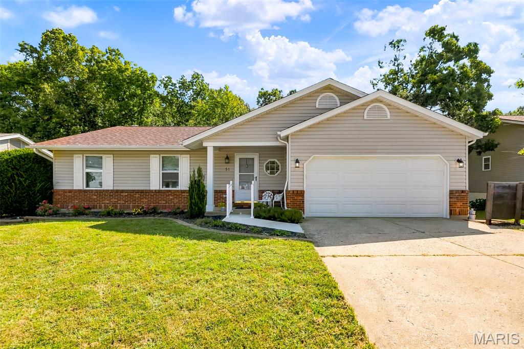 Welcome home to this ranch retreat with scenic tranquility! The main level boasts durable luxury vinyl plank flooring & stylish newer carpeting, alongside a completely updated kitchen with sleek stainless steel appliances, solid surface counters & 42" cabinetry with soft close features.. Beautiful cabinetry & countertop continue into main level laundry. Step outside onto the low-maintenance composite deck to take in peaceful views of your walkout lot which backs Ft. Zumwalt Park. Oversized patio at walkout lower level for additional outdoor space. Lower level features large 4th bedroom & a powder room and a spacious family room with wood burning stove & cute craft room while still allowing for additional storage. Recent updates roof, siding, windows, flooring & geothermal system.