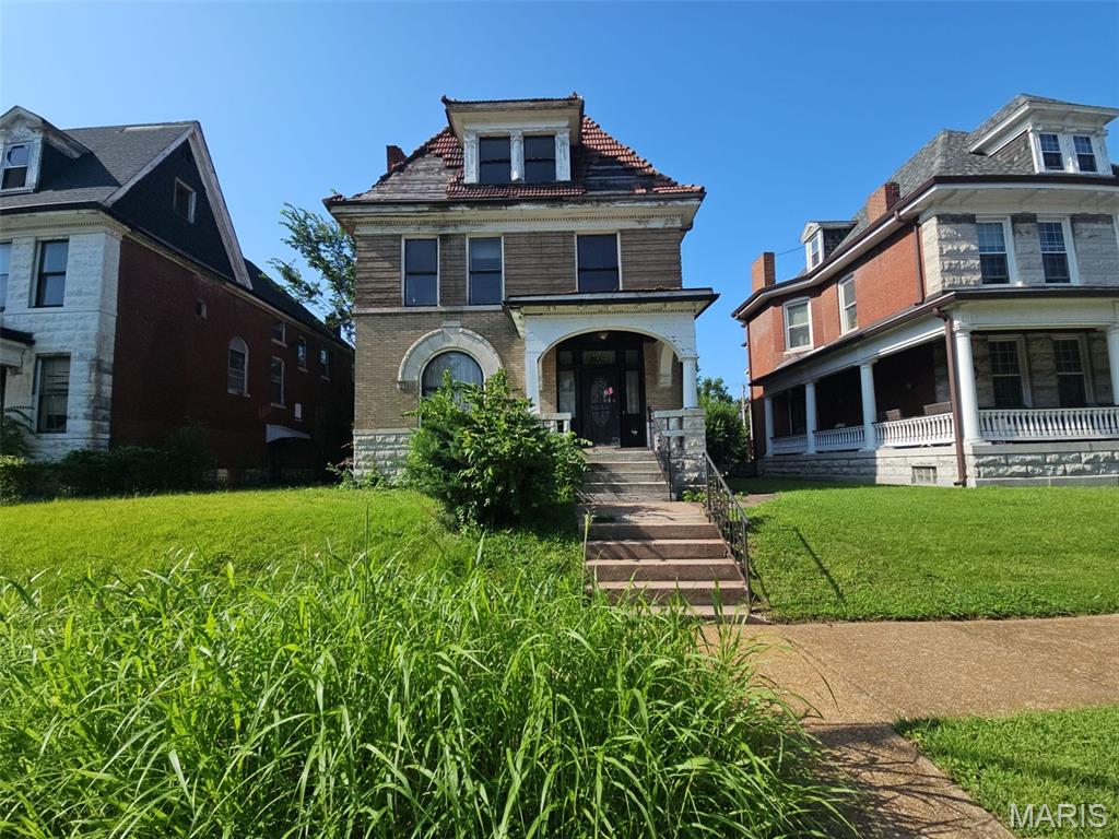 Discover this 2.5-story historic home, with approximately 2,736 square feet of living space, 5 spacious bedrooms, and 1.5 baths. This property features 4 classic fireplaces and endless opportunities to customize and bring your design vision to life. Sold strictly as-is, this home is priced to reflect its current condition and is ready for the right buyer to roll up their sleeves and restore its true splendor. Don't miss this fantastic opportunity to add a high-potential property to your portfolio!