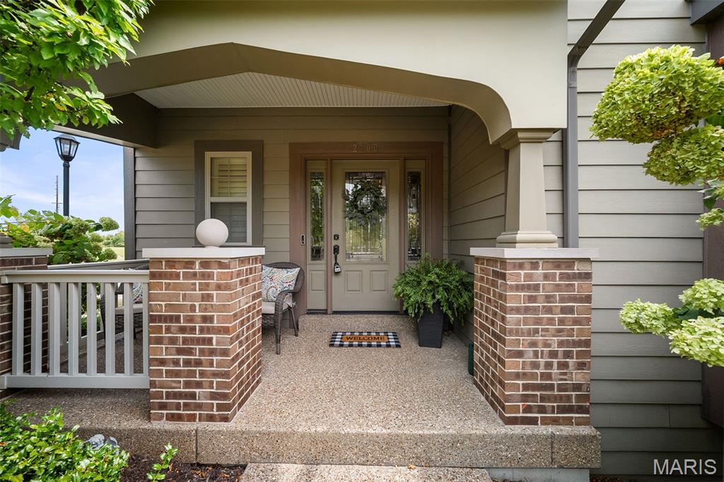Welcome to this fresh, neutral, former display attached villa home, conveniently located close to the Wildwood Towne Center.  This stunning 1.5 story home offers a dramatic 2 story great room w/fireplace, a kitchen w/granite, travertine backsplash & stainless-steel appliances.  Breakfast room provides access to the deck.  The main floor primary has a bath w/ separate shower, soaking tub & large walk-in closet.  Wood flooring, crown molding, plus custom plantation shutters throughout.  2 bedrooms, full bath & a large loft area/second family room w/skylights complete the upper floor.  The LL has an egress window for a future finish.  Water heater 2022, quartz countertops added to primary & half bath, newer closet system in primary & roof 2026.  Oversized, rear entry, 2 car garage w/high volume ceiling.  Main floor laundry.