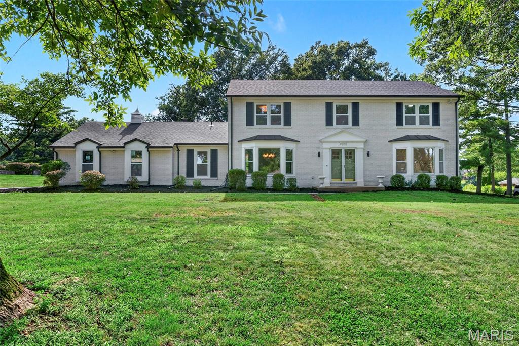 **New & improved Price!** Masterfully renovated from top to bottom, this exceptional custom brick Colonial offers a rare opportunity to own a truly turnkey luxury home on nearly one acre in one of the area's most sought after neighborhoods. This remarkable residence delivers an effortless balance of sophistication, comfort, and everyday livability. From its stately curb appeal to its thoughtfully curated custom interiors, every detail has been carefully selected to create a home that is as impressive as it is welcoming.

Inside, a gracious traditional floor plan unfolds with beautifully proportioned living spaces designed for both elegant entertaining and comfortable daily living. Rich engineered hardwood flooring extends throughout the main and upper levels, while abundant natural light fills every room through large new windows. The inviting family room is anchored by exquisite millwork, a stunning fireplace, and a beautifully appointed bar with mini fridge, creating the perfect gathering space. Expansive double sliding glass doors open to the impressive patio, seamlessly blending indoor and outdoor living.

The heart of the home is a spectacular custom chef's kitchen designed to satisfy both the passionate cook and the avid entertainer. Custom built soft close cabinetry, quartz countertops, premium stainless steel appliances, designer tile backsplash, under cabinet lighting, and exceptional craftsmanship create a space that is equal parts beautiful and functional. The adjoining breakfast room, complete with its own fireplace, offers a warm and inviting setting for casual meals, while a separate dining room is perfect for more formal occasions such as dinner parties or hosting the family for the holidays. A spacious mudroom and main floor laundry area provide everyday convenience, while an additional main level room offers outstanding flexibility as a private home office, guest bedroom, second laundry room, or an extraordinary butler's pantry- This space can easily be customized to your family's needs.

The private backyard is a peaceful extension of the home, offering nearly an acre of beautifully maintained grounds backing to common ground and surrounded by mature trees. The space feels private and upscale while still being close to all of the amenities that Chesterfield has to offer. Whether hosting family and friends, enjoying summer evenings on the expansive  recently landscaped patio, or simply relaxing in complete privacy, the outdoor space provides the perfect setting for every occasion.

The luxurious primary suite serves as a true retreat, offering generous proportions, abundant natural light, and ample space for both a king sized bedroom set and a comfortable sitting area. A custom solid wood walk-in closet system provides exceptional organization, while the beautifully renovated spa-inspired bathroom offers elegant finishes and a sophisticated atmosphere. Three additional spacious bedrooms and a beautifully updated bathroom with a double vanity finish out the second floor and continue the home's commitment to quality and timeless design. 

The finished lower level provides substantial additional living space ideal for a recreation room, media room, fitness area, game room, or guest accommodations. There is also a large unfinished area with additional laundry hookups. Perfect for storage or a second washer and dryer set.

Extensively renovated with no detail overlooked, this extraordinary residence features new windows, a spectacular custom kitchen, three beautifully renovated luxury bathrooms, two stunning fireplaces,  a finished lower level, and countless premium upgrades throughout. Combining timeless elegance, exceptional craftsmanship, and modern luxury in one of the area's most desirable locations, this is a rare opportunity to own a home where every space has been thoughtfully designed and every finish carefully selected. Simply move in and enjoy!