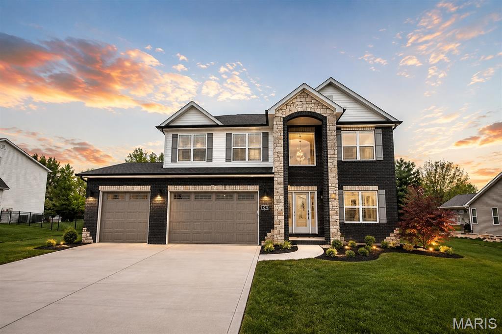 Luxury, space, and thoughtful design come together in the stunning Tucker floor plan by CNR Homes. Offering nearly 4,000 square feet of finished living space, this exceptional home features 5 bedrooms, 3.5 bathrooms, a finished lower level, and a finished 3-car garage—designed to accommodate today's lifestyle with style and comfort.

Step through the impressive two-story foyer where soaring ceilings, abundant natural light, and a custom built-in drop zone create a memorable first impression. A spacious private office near the entry provides the perfect work-from-home space while maintaining privacy from the main living areas.

The heart of the home is the expansive open-concept living space, where the chef's kitchen seamlessly flows into the dining area and great room. Rich custom cabinetry, Quartz countertops, an oversized center island, stainless steel appliances, and an incredible walk-in pantry with custom shelving make this kitchen as functional as it is beautiful. The spacious family room is anchored by a modern fireplace with custom accent detailing, creating the perfect gathering space for everyday living and entertaining.

Upstairs, the luxurious primary suite offers a true retreat with an oversized bedroom, spa-inspired bath featuring dual vanities, a soaking tub, separate shower, and an enormous walk-in closet. The upper level also includes generously sized secondary bedrooms, spacious bathrooms, and an inviting loft that provides additional flexible living space.

The professionally finished lower level expands the home's versatility with a large recreation room, fifth bedroom, full bath, and plenty of room for movie nights, game days, or guests.

Outside, enjoy a covered patio overlooking the backyard—perfect for relaxing or entertaining year-round.

Located in The Summit of Shiloh, this exceptional CNR Homes design combines timeless architecture, premium finishes, expansive living spaces, and outstanding craftsmanship in one of the Metro East's most sought-after communities. This is luxury living designed for the way you live today.