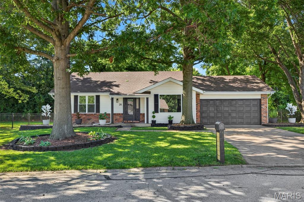Completely renovated from top to bottom, this stunning 4 bedroom, 2.5 bath ranch with over 2300 square feet of living space is the definition of move-in ready. Featuring a timeless black-and-white design and cohesive finishes throughout, this home shows like a display and offers the perfect blend of style, comfort, and functionality. Tucked away on a quiet cul-de-sac in the highly sought-after Fort Zumwalt School District, this is truly a must-see home. From the moment you arrive, this home impresses. Fresh landscaping, vinyl siding with brick accents, and a heated and cooled two-car garage create outstanding curb appeal that sets the stage for what awaits inside. Step into the spacious living room, where a large picture window fills the space with natural light and flows seamlessly into the beautifully renovated kitchen and dining area. The stunning kitchen showcases new cabinetry, quartzite countertops, a tile backsplash, a center island, stainless steel appliances, and a pantry, offering both style and functionality. The adjoining dining area provides ample space for gatherings and opens to the incredible heated and cooled sunroom that spans the entire length of the home, creating exceptional additional living and entertaining space to enjoy year-round. From the sunroom, step outside to the expansive backyard featuring a wrought iron fence and mature trees that provide added privacy. The primary suite offers a walk-in closet and an updated private bath featuring a beautifully tiled shower. Two additional bedrooms and an updated full bath complete the main level. The finished lower level adds even more living space with a large family room, adjoining recreation area, an updated half bath, and a fourth bedroom or office with an egress window. New carpeting and abundant storage space make the lower level both comfortable and functional. Residents can also enjoy the subdivision pool during the hot summer months. Conveniently located near shopping, restaurants, and major highways, this home offers easy access to nearly anywhere in the St. Louis area within 30 minutes. Beautifully updated with timeless design, modern updates, and exceptional living spaces throughout, this exceptional home offers the perfect blend of style, comfort, and functionality and is ready for you to call it home. Schedule your private showing today.