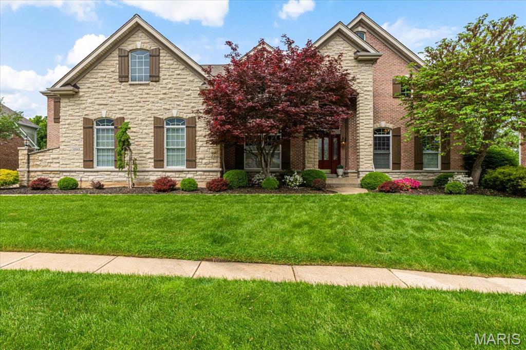 This impressive 1.5-story home offers over 7,000 sq. ft. of luxurious living space on a private 1-acre lot. The grand 2-story foyer is flanked by a stately study with French doors & built-ins, along with a dining rm. The 2- story great rm boasts a gas fireplace & built-ins . The updated kitchen shines with quartz countertops, a tile backsplash, center island, stainless steel appliances, double ovens, a wet bar & an adjoining breakfast rm. The ML primary is a true retreat with a 12-ft ceiling, bay window, a cozy sitting rm with its own fireplace & a luxury full bath. Upstairs, you’ll find 3 spacious bedrms, 2 full baths, plus a versatile bonus rm. The walk-out LL is designed for entertaining, featuring a family rm with a stone fireplace, game rm, exercise rm, an extraordinary wine cellar with a wet bar, half bath & 5th bedrm with a full bath. Step outside to enjoy the composite deck overlooking a serene, wooded yard, complete with a water feature. A must-see home in a premier location!
