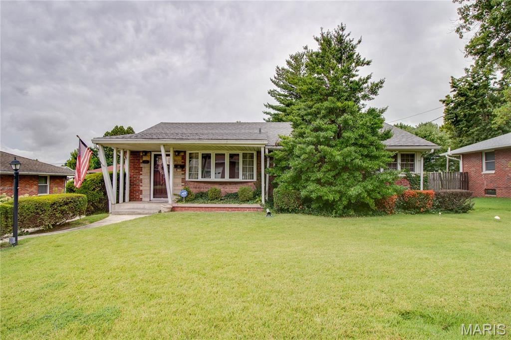 Full brick 2-bedroom, 1.5-bath home with the potential to easily convert back to a 3-bedroom floor plan! The eat-in kitchen features granite countertops and plenty of cabinet space. The finished basement provides additional living space with a spacious family room and bonus room, perfect for a home office, playroom, or hobby area. Enjoy your morning coffee on the covered front porch or unwind on the covered back patio overlooking the backyard. The oversized detached 1-car garage (27’ x 19’) includes a concrete floor, power, and a workshop, making it ideal for projects, storage, or extra workspace. A perfect combination of comfort, flexibility, and functionality. MAKE AN APPOINTMENT TODAY!