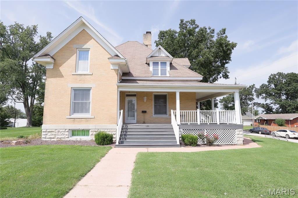 Welcome to a home that feels like a piece of Perryville’s story where timeless craftsmanship, character, and charm come together in a truly special setting. Nestled on nearly a full acre in the heart of the city, this remarkable property offers a rare combination of historic beauty and the space today’s homeowners desire. From the moment you step inside, you’ll be captivated by the beautiful woodwork, intricate trim, stained glass accents, and architectural details that simply cannot be replicated in modern construction. Warm natural light fills the spacious rooms, creating an inviting atmosphere that makes you want to slow down, settle in, and stay awhile. Whether you're hosting friends and family, creating a workshop in the detached garage, enjoying the expansive grounds, or simply appreciating the character found around every corner, this home offers something truly special. Properties with this much history, craftsmanship, land, and presence rarely come available in the heart of Perryville. If you're looking for more than just a house, if you're looking for a home with a story, a soul, and a feeling all its own, you owe it to yourself to see this one in person.