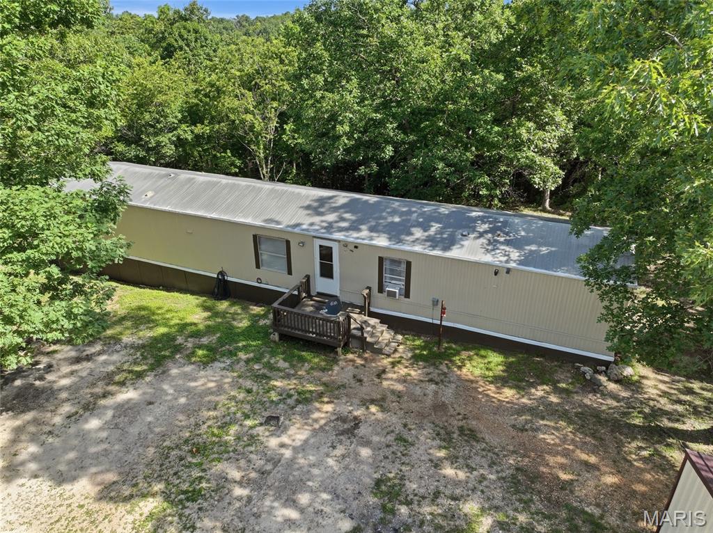 Escape to the peace and privacy of country living with this beautifully maintained 3-bedroom, 2-bath home situated on 5 picturesque acres. Surrounded by nature and abundant wildlife, this property offers the perfect setting for those seeking a quieter pace of life while still enjoying the comforts of home. Wake up each morning to the sight of deer wandering through the property and spend your evenings relaxing beneath the stars in a setting that feels miles away from the hustle and bustle. The well-cared-for home provides a comfortable and inviting atmosphere, with plenty of space for everyday living and entertaining. Whether you're looking for a full-time residence, a weekend retreat, or a place to enjoy the outdoors, this property offers endless possibilities. An equipment shed provides convenient storage for tools, recreational gear, or equipment, making it easy to maintain and enjoy the acreage. The open space offers room for gardening, hobby farming, outdoor recreation, or simply enjoying the beauty of your own private slice of the countryside. If you've been dreaming of peaceful rural living with room to roam and nature right outside your door, this property deserves a closer look. Schedule your private showing today and discover the tranquility and charm this beautiful acreage has to offer!