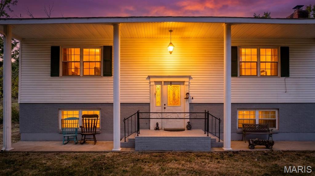 Check out this home with acreage on Highway 8 West in Potosi! This 5-bed, 2-bath home on 20.45+/- acres is secluded in timber yet located conveniently close to town. Originally built in 1975, this large colonial-type home offers a unique layout with a nostalgic style. Host all of your family events here in the large work-in kitchen adjoining the huge dining room. The screened-in porches provide a beautiful outdoor atmosphere with many possibilities, including extra storage, a workout room, a game/hobby room, or a place to relax. The tuck-under 2-car garage is perfect for all things tool-tinkering. There is also a "hidden" cellar under the screened-in porch that could be used as a safe haven or protected storage. The acreage is mostly timber. There are some hardwoods scattered across the land. This property is home to many species of mid-MO wildlife, including white-tailed deer and wild turkey. Many farms surround this property, making this heavily wooded land a perfect home for the outdoorsman while still maintaining a nearly 5-minute drive to Potosi. Don't miss this unique opportunity in the Ozarks!