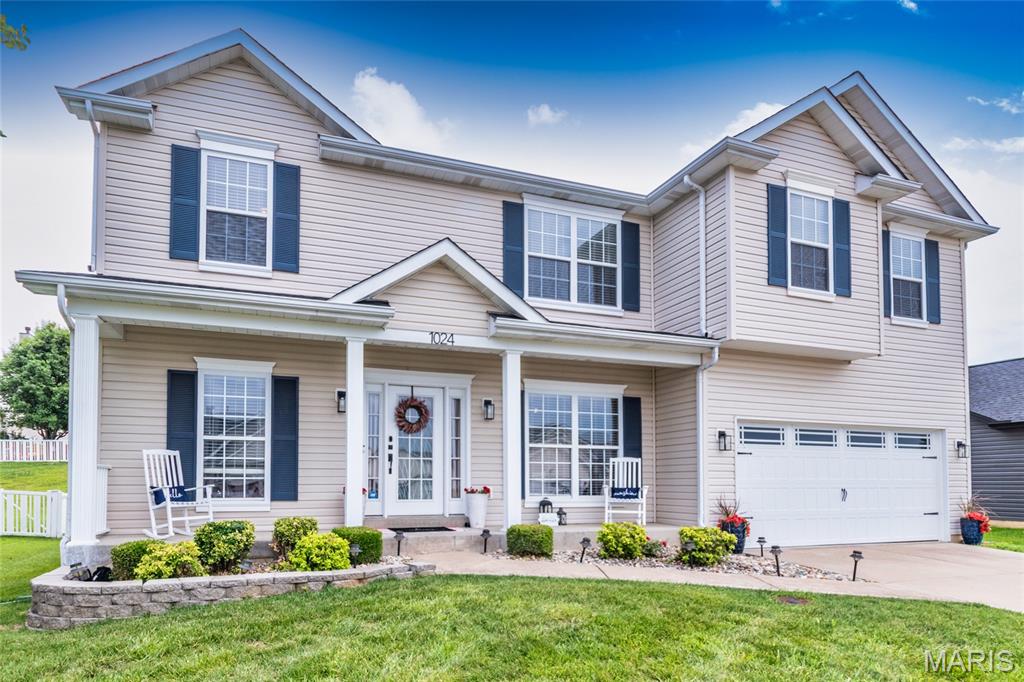 Over 3400+ Sq. ft. of living space with this Sizeable 2 story in the highly desirable Meadow View neighborhood! Beautiful curb appeal with low-maintenance landscaping and a welcoming front porch sets the tone for this spacious and light-filled home. The open, flowing floor plan features 9’ ceilings on the main level, neutral and and abundant of natural light throughout. The inviting great room showcases floor-to-ceiling built-in bookshelves, while the formal dining room offers ample space for entertainment. The bright, updated kitchen features 42” white cabinetry, quartz countertops, stainless appliances, double oven, newer luxury vinyl flooring, and lg. walk-in pantry. A main-floor office, laundry room, and powder room add everyday convenience. Upstairs, retreat to the expansive primary suite with dual 8 X 7 walk-in closets and a luxurious bath with separate tub and shower. Three additional spacious bedrooms, with 10 X 5 upper full bath. A versatile, upper 16 X 12 family area completes the upper level. Backyard w/extensive patio to relax and dining out. The lower level offers endless possibilities with abundant storage space and a rough-in for a future bathroom. Numerous updates include a newer roof, solar panels with reduced Electric Bill under $50.00 per month, and more. Ideally located near parks, schools, highways, and just minutes from Gravois Bluffs shopping, dining, and entertainment. This is a must-see home — schedule your private showing today!