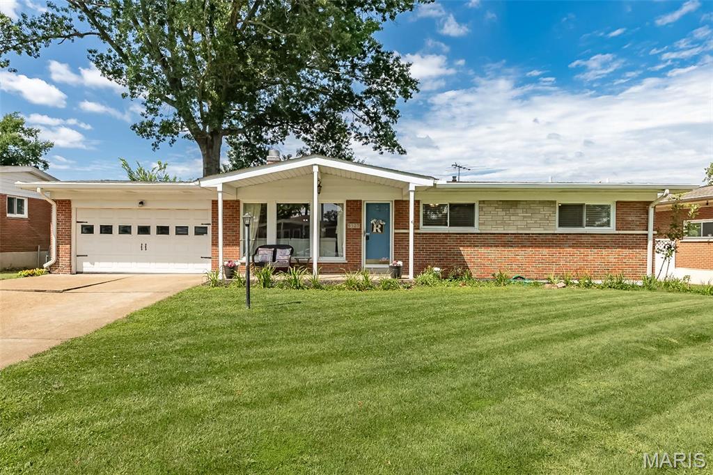 Welcome to this beautifully updated ranch in the heart of Crestwood, where modern comforts meet classic charm. From the moment you step inside, you’ll notice the gleaming hardwood floors that flow throughout the main level and the abundance of natural light pouring through the newer vinyl windows. The living room serves as a cozy centerpiece, featuring a gas fireplace perfect for relaxing cozy evenings this Fall.

The kitchen is a true showstopper, thoughtfully redesigned with custom cabinetry, sleek solid surface countertops, and an island with a breakfast bar for casual morning coffee. It’s a chef’s dream equipped with a gas cooktop, stylish new pendant lighting, and plenty of counter space. Just off the kitchen, a spacious dining room for those larger meals and a fantastic three-seasons room—an ideal spot to enjoy the backyard views in comfort.

Both full bathrooms have been fully renovated to offer a spa-like experience, boasting adult-height vanities, custom tile surrounds, and all-new toilets and flooring.

The updates continue in the lower level, which features newer LVP flooring across a large recreation room and a separate den, providing plenty of flexible space for your lifestyle needs. Peace of mind comes standard here, thanks to a newer 2022 electric panel, new plumbing lines and stacks, a radon mitigation system (2022), and a brand-new HVAC system installed in 2024.

Located in the highly sought-after Lindbergh School District, this home puts you minutes away from the incredible amenities of Whitecliff Park. With its perfect blend of major system updates and high-end aesthetic finishes, 9327 Ewers Dr is ready for you to move right in and start living.