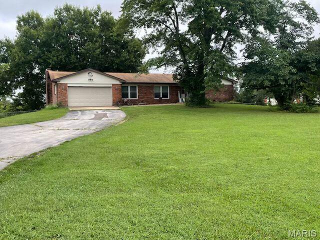 This well maintained full brick home sits 2.5 acres, plenty of outdoor space.  The home features 1,935 square feet on the main floor, with 3 bedrooms and 2 bathrooms, and main floor laundry.  The partially finished walkout basement has finished kitchen area, a cozy fireplace, and 3rd bathroom.  Several finished areas that can be used as family room, home office, or hobby area. Additional unfinished space for storage or future expansion.  Oversized 2car  garage with windows completes this very appealing property.