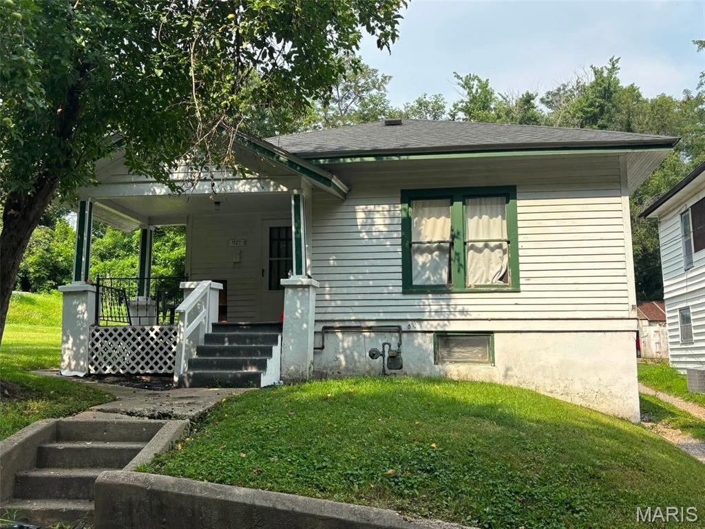 Two bedroom home sitting on a double lot. This home is full of charm from the covered front porch to original hardwood floors you definitely don't want to miss this one!