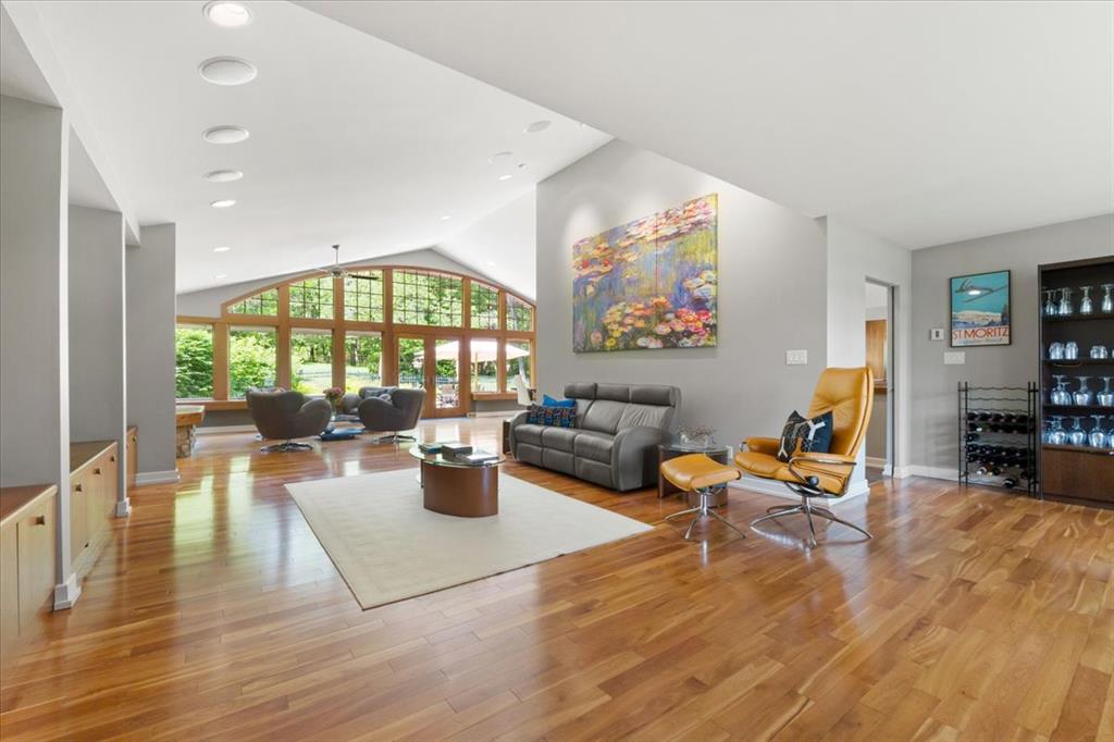 Just south of Eureka and only 30 minutes from downtown St. Louis, this beautifully renovated home offers luxury, privacy, and functionality on nearly 10 acres—already divided into 3 parcels for future potential. With 3 bedrooms, an office, 3 full and 2 half baths, and premium finishes throughout, it's perfect for discerning buyers and equestrian lovers alike. Open the rich solid mahogany door to find an open floor plan with gleaming cherry wood floors, vaulted ceilings & expansive windows across the back of the home designed to soak in the beauty of the property. The hub of the home home features a sleek Euro-style kitchen with custom cherry cabinetry, huge island with quartz counters, high-end appliances including a built-in coffee system.  Enjoy resort-style living with a peaceful in-ground pool, a 6-stall stable, riding arena, and equipment garage. Energy-efficient geothermal HVAC adds comfort year-round. This property offers the ideal blend of refined living and rural charm.