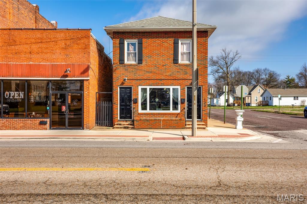 Position your business for success in this prime downtown mixed-use property offering exceptional visibility and steady foot and vehicle traffic. Perfectly suited for entrepreneurs and investors alike, this versatile building combines a turnkey commercial space with an income-producing residential unit above. The main level features a fully operational salon and spa, thoughtfully designed for efficiency and client comfort. The functional layout supports a wide range of beauty and wellness services, including a private spa treatment room added in 2023 to expand service offerings. A recently installed heating and A/C system ensures year-round comfort and energy efficiency. This turnkey setup is ideal for an owner-operator ready to step in or an investor seeking a ready-to-lease commercial space.
Upstairs, a spacious 2-bedroom, 1-bath apartment provides immediate rental income, as it is currently tenant-occupied. With a separate entrance and private living space, the residential unit offers convenience and privacy for occupants, making it an attractive long-term rental. Additional highlights include two private parking spaces - a rare and valuable feature in a downtown location - and a main-level storage room accessible to both commercial and residential tenants. With strong income-producing potential and dual revenue streams, this property is an outstanding opportunity for a live/work setup, owner-user, or passive investor. The established salon and spa layout is especially appealing for service-based businesses seeking high exposure in a thriving location. Call today to schedule your showing! Seller will also consider leasing the business space for $1,500 per month which includes utilities, internet and trash.