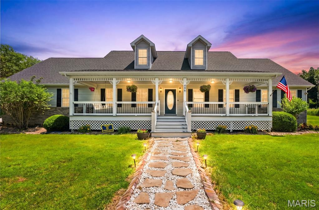 Welcome to this beautiful retreat nestled on 3 private acres, offering privacy, space, and modern comfort just minutes from town.

Start your mornings with coffee or unwind in the evenings on the expansive front porch that stretches across the entire front of the home. Inside, you’ll find an open-concept layout featuring spacious living areas and a generously sized primary suite. The main level offers 3 bedrooms, 3 full bathrooms, and abundant storage throughout.

The finished walk-out lower level is designed with fun and functionality in mind featuring a rock-climbing wall, built-in fort off the playroom, bonus sleeping space, and an additional full bathroom, making it ideal for kids, guests, or multi-purpose living.

Step outside and enjoy everything this property has to offer room to roam, swings, and a newly planted orchard with 3 fruit trees already started for you. For hobbyists, car enthusiasts, or extra storage needs, you’ll love the finished attached 2-car garage plus the impressive 30x40 detached garage complete with concrete floors, electric, and a 12-foot lean-to.

This one-of-a-kind property offers privacy, space, and endless opportunities to enjoy country living at its best.
