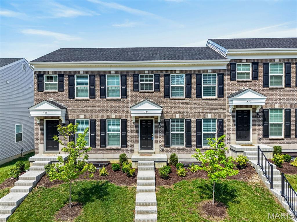 Why wait months to build when you can move right into this less-than-one-year-old McBride-built townhome that's already been perfected? Skip the delays, unexpected costs, and construction hassles while enjoying the benefits of a nearly new home that's truly move-in ready.

This beautifully designed 2-bedroom, 2.5-bath townhome with a 1-car garage and professionally finished basement offers stylish finishes, thoughtful upgrades, and additional living space rarely found in comparable homes.

The open-concept main level features luxury vinyl plank flooring, recessed lighting, a rare main-floor half bath, and a stunning kitchen showcasing 42" blue cabinetry, granite countertops, upgraded stainless steel appliances, a deep undermount stainless steel sink, and a separate pantry.

Upstairs, both bedrooms feature walk-in closets and overhead lighting. The spacious primary bedroom offers a large walk-in closet and private access to the full hall bath, which also serves the second bedroom. The bath features a double-bowl vanity with trendy gold fixtures and a tub/shower combination.

The professionally finished lower level adds exceptional living space with a spacious family room featuring an egress window, closet, and abundant recessed lighting. A beautifully finished full bath with a walk-in shower and adult-height vanity offers endless possibilities for guests, entertaining, a home office, or recreation.

Additional features include two-panel doors and trim, custom blinds, a security system, and finishes that make this home stand out from the rest.

Why build when you can enjoy a home that's already complete, beautifully upgraded, and move-in ready? Everything has already been finished, inspected, and fine-tuned, allowing you to simply unpack and start enjoying your new home from day one.