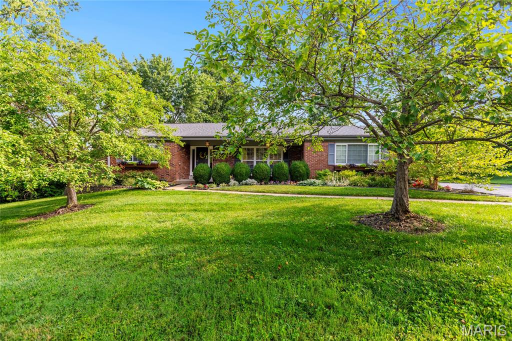 Back on Market - No Fault to Seller. Completely updated and truly move-in ready, this home welcomes you with new landscaping refresh leading to a charming front porch. 

Inside, gorgeous hardwood floors flow throughout. Beautiful built-in shelves anchor the living space and offer clever hidden access behind them to keep all your media tucked neatly out of sight. 

The kitchen shines with nearly-new appliances and opens to an inviting eat-in area - perfect for everyday meals and entertaining alike.

Step out to the covered deck and enjoy everything from crisp spring mornings to warm summer nights to beautiful fall evenings. Upstairs you'll find three generously sized bedrooms and two full bathrooms. 

The finished walkout lower level is ready to become your dream recreation or media room, with plenty of storage to spare. Outside, the fully fenced backyard offers privacy and room to play. 

A rare combination of fresh updates and thoughtful design, this one won't last long!