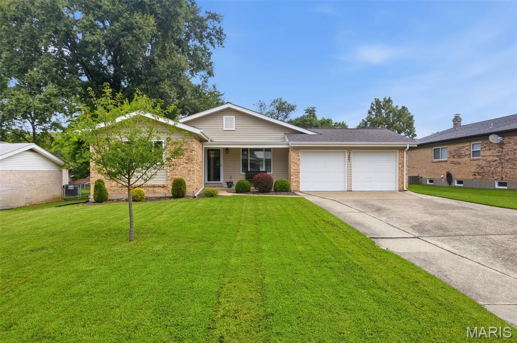 Bright, cheerful and full of space to spread out, this 3-bedroom, 2-bath ranch is one you’re going to want to see! Natural light pours throughout the home, highlighting the fresh, neutral finishes and beautiful flooring that give the entire space a light and airy feel. And with 1,443 sq ft, the layout offers more room than you might expect! Enjoy TWO inviting living areas, including a spacious family room with a cozy fireplace and built-ins, plus a separate dining room ready for everything from weeknight dinners to holiday gatherings. The kitchen keeps everyone connected with stainless steel appliances, plenty of cabinetry, a center island with seating and easy access to the backyard.

The primary bedroom features its own private bath, while two additional bedrooms offer flexibility for family, guests, a home office or whatever fits your lifestyle. Need even more? The unfinished lower level provides plenty of storage and room for future possibilities.

Now for the backyard, because this one deserves some attention! Step outside to a HUGE, level fenced yard with room to run, play, garden and entertain. The covered gazebo patio creates the perfect outdoor hangout for grilling with friends, crisp fall evenings and bonfires under the stars. There’s even a storage shed that stays!

Add a 2-car garage, neighborhood park and trails conveniently located at the end of the street, and AAA-rated Rockwood School District, and this sweet ranch brings together space, location and a backyard you’ll actually use. Showings begin August 28, mark your calendar!