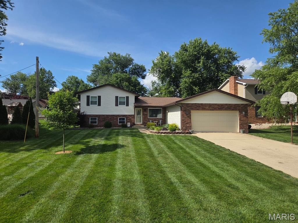 Beautifully updated tri-level home situated on 1/3 acre in a well-established subdivision. The backyard is designed for both entertaining and everyday enjoyment, featuring a covered patio and fenced yard that provide added privacy and functionality. Step inside to a warm and welcoming living room and an updated kitchen equipped with stainless steel appliances. Most of the upper levels feature LVP flooring, adding both style and durability throughout the home. The main level offers a dedicated office space with an adjoining half bath, providing flexibility for a home office, guest area, or potential conversion to suit your needs. The lower-level family room includes an adjoining full bath, creating exceptional living space. Don't miss the hidden surprise of extra storage in the lower-level closet. Don't miss the opportunity to view this property!