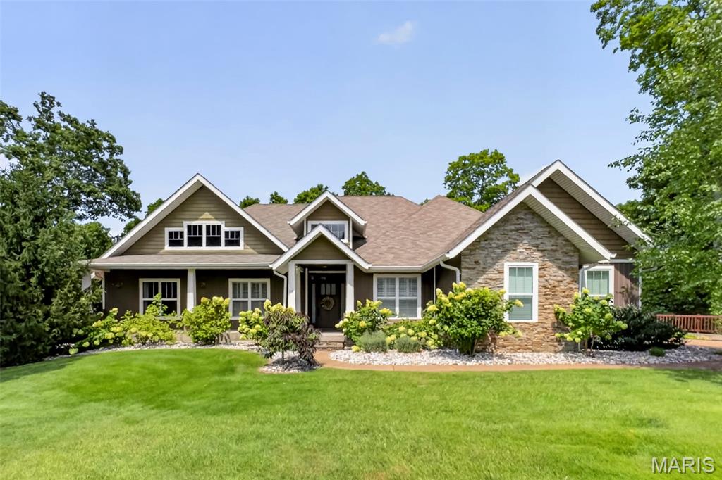 Nestled on a private cul-de-sac in the highly coveted Pine Lake Estates, this fully updated residence delivers an undeniable wow factor from the moment you arrive. Quality construction is evident throughout, featuring a poured concrete basement/foundation complemented by stone veneer and vinyl siding. Inside, expansive, light-filled rooms are elevated by soaring cathedral ceilings, refined crown molding and impressive 8’ doors, creating an atmosphere of understated elegance. The thoughtfully designed split floor plan balances open, gracious living spaces with privacy where it matters most.

At the heart of the home, the beautifully appointed kitchen is designed for both everyday living and entertaining, featuring custom cabinetry, a walk-in pantry, dual KitchenAid gas stoves and a KitchenAid microwave. First-floor laundry adds another layer of convenience to the home’s thoughtful layout.

Smart-home comfort meets everyday convenience with Sonos speakers throughout the entire home and high-speed internet availability. The dual-zone HVAC system separates the primary suite from the main living area, while the main living space features a WiFi-enabled HVAC system installed this year and backed by a 10-year warranty-an important assurance for years of comfort and reliability. Yearly maintenance on the heating and cooling system, along with a water softener already in place, adds even more peace of mind.

The primary suite serves as a private retreat, anchored by a brand-new walk-out sunroom—an exceptional addition offering a serene escape for quiet mornings or peaceful evenings at home.

The finished portion of the lower level expands the home’s versatility with an impressive open-concept recreation space, providing plenty of room for entertaining, a game or media area, fitness space, or additional gathering space while still allowing flexibility to make it your own.

Outdoor living is equally impressive, with a covered deck and multiple covered patio areas providing inviting spaces to relax or entertain in nearly any weather. An in-ground sprinkler system makes maintaining the grounds effortless, while invisible pet fencing adds convenience for four-legged family members.

Homes offering this combination of space, thoughtful updates, quality construction and modern conveniences in Pine Lake Estates are rarely available. Schedule your private showing today.