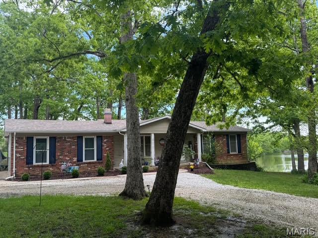 Charming 3-bedroom, 2-bath ranch home on 1 acre with serene lake access awaits its new owner. Featuring a walkout basement, this property offers endless potential for entertaining and enjoying the outdoors. Nestled in unincorporated St. Charles County within the sought-after Wentzville School District, it provides the perfect blend of peaceful living and convenient access to area amenities. Don’t miss your chance to make this lakeside retreat your own! 
New roof April 2024 by John Beal Roof. New Well Pump '2025