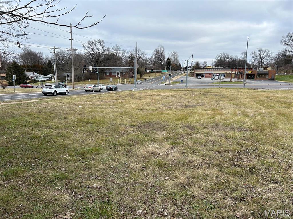 1.76+/- acres of prime commercial property. 
Are you looking for a great signalized high traffic hard corner location for your restaurant, car wash, strip center, or next office building?  This property provides 290 feet of frontage along St. Cyr Rd & 258 feet along Lewis & Clark allowing for strong visibility and access from both Lewis & Clark and St. Cyr Road.  Owner would also consider a ground lease.  There is also the potential to utilize a TIF for this property.  Please check with the city of Jennings.  See also listings 26029703 and 26029698.

The City of Jennings, Missouri is located in North St. Louis County, about 20 minutes north of Downtown St Louis via Interstate 70 and Highway 367. Major thoroughfares for the community are Halls Ferry Road, Highway 367/Lewis and Clark Blvd. and Chambers Road.  North County is home to Lambert-St. Louis International Airport, Boeing's Defense, Space & Security unit, Emerson Electric Company, and Centene. Location: Corner Location, High Traffic, Hwy/Interstate Frntg