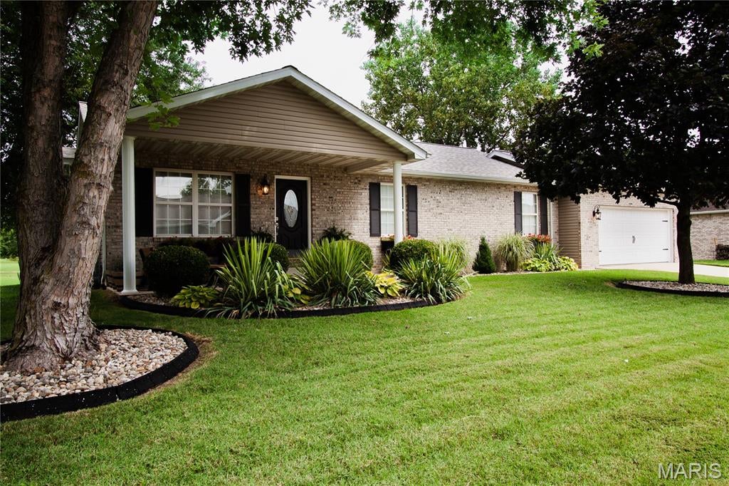 Here it is...  this is the one you have been waiting for… contact your agent now and come take a look before it is gone. No remarks written here can compare to a personal tour of this IMMACULATE, exceptionally-maintained, 3BR (easily 4BR), 3BTH home situated among the gorgeous properties in the highly-coveted area that surrounds Legacy golf course, NO HOA! Properties in this exclusive area rarely come onto the market. SO MANY upgrades you must see for yourself.  Cozy Greatroom with fireplace and dining area, amazing kitchen space with included stainless appliances. LOTS of storage and countertop space with under-cabinet lighting. Completely finished basement with egress window, utility room, under-staircase storage area (also finished), office/makerspace/future 4th bedroom (with slight modification), AND a fully-wired-for-sound theater room with wet bar. Priced to sell. Unique features of this listing include: 
-New Class 3 roof installed June of 2026 with transferable warranty
-New furnace and A/C installed in June of 2025 under warranty (will check on transferability to new owner)
-New hot water heater installed in October of 2023
-New slider door installed in February of 2026
-Deck completed 2024
-New swing-set installed in May of 2025
-Fully prewired home theater room
-Egress window
-Direct golf course access
-Close Wilson Park access
-Nearby bike trail access
-Only minutes from numerous interstates