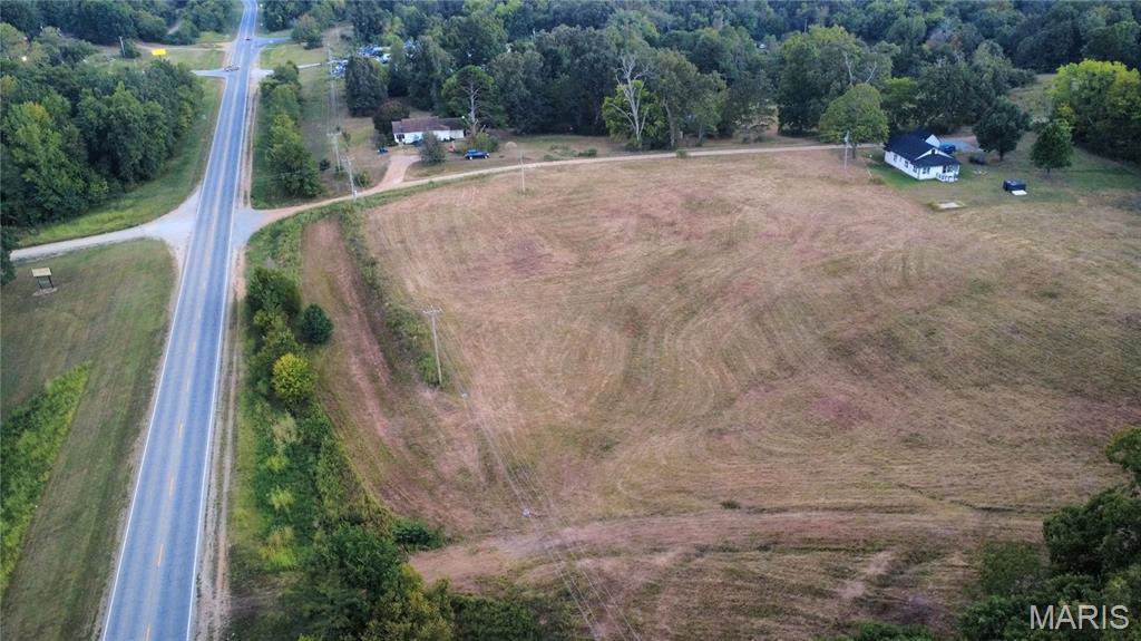 Wow! Take a look at this beautiful building site, located 1 mile outside town. This 5.5 acres can be utilized for apartments, duplexes, mobile court, open pasture, subdivided into a subdivision or anything you can build there! This parcel is a rare unrestricted parcel with 4 water meters in place! There is a solid based road entering the property from the highway and a gravel road that is a shared right of way down the south side of the property boundary. There is electricity to the parcel, however, no meters are present. All this priced for $65,900! Call today, DO NOT ENTER ONTO PARCEL WITHOUT APPOINTMENT!  This is private, posted property.