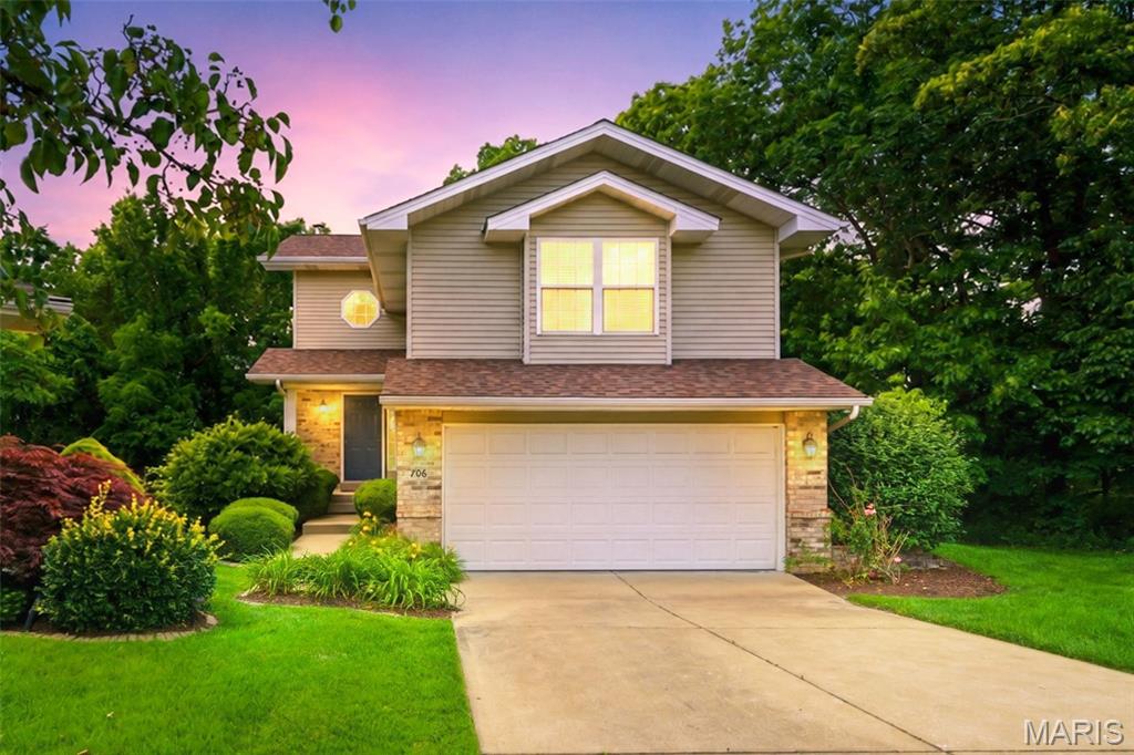 Welcome home to this beautifully maintained Lake St. Louis property offering over 2,200 square feet of finished living space, low-maintenance living, and access to all the outstanding Lake St. Louis amenities. Tucked away on a quiet cul-de-sac and surrounded by mature trees, this home provides both privacy and plenty of space for everyday living and entertaining. A two-story entry foyer welcomes you inside and opens to the inviting family room featuring a gas fireplace, abundant natural light from oversized windows, and a French door leading to the composite deck overlooking the wooded backdrop. The well-appointed kitchen is sure to impress with light cabinetry, granite countertops, stainless steel appliances, a gas range, and a pantry for additional storage. Just a few steps up, you'll find a spacious bedroom with a large walk-in closet and an adjoining full bath. The upper level features a generous primary suite complete with a walk-in closet and private bath with dual sinks, along with a third bedroom that also offers a walk-in closet. Convenient second-floor laundry adds to the home's functionality, and the washer and dryer are included. Need even more living space? The finished lower-level recreation room is the perfect gathering spot, featuring a full bath, storage area, and walkout access to a private patio surrounded by nature. Enjoy a carefree lifestyle with lawn care, landscaping, and snow removal provided by the association. Plus, take advantage of all the recreational amenities Lake St. Louis has to offer. Major updates provide peace of mind, including the roof, HVAC system, and water heater—all less than five years old. $210 monthly fee for lawn, landscape, snow and yearly fee for LSL amenities.