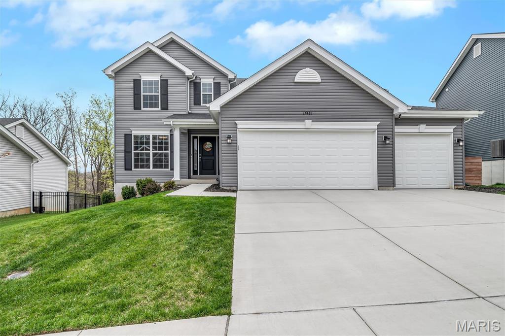 Welcome home to 17481 Wyman Ridge located in the beautiful Arbors of Rockwood where modern design meets everyday family living.  Just 3 years young, this thoughtfully designed 4 bedroom, 2.5 bath home offers the perfect blend of comfort, style and functionality in a peaceful, family-friendly setting.  Step inside to an inviting open floor plan filled with natural light, ideal for both busy mornings and relaxed evenings together.  The heart of the home is the spacious family room, featuring custom built-ins surrounding a sleek black fireplace perfect for movie nights, holiday gatherings or simply unwinding at the end of the day.  The luxury kitchen is sure to impress, complete with quartz countertops, oversized island ideal for gathering, an induction cooktop, and a whole-home water filtration system.  Whether you're preparing weeknight dinners or entertaining guests, this space combines high-end finishes.  Designed with families in mind the home also features built-in cubbies to keep backpacks, shoes, and daily essentials organized and within reach. Upstairs you'll find four generously sized bedrooms, offering space and privacy for everyone, 2 full baths along with the convenience of an upstairs laundry room that makes daily routines that much easier.  Step outside to a large composite deck with sleek black iron railing, offering a private, scenic view of wooded common ground.  The walk-out lower level is waiting for your finishing touches. and presents limitless possibilities.  Located in the highly sought-after Rockwood School District.  This premier community has it all including fenced in dog park, walking trails, picnic areas, a fishable lake, and a public library.  This stunning home is Move-in ready and perfectly suited for today's family lifestyle.