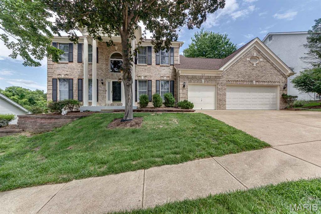 From the welcoming curb appeal to the freshly updated interior, this home is move in ready! This 4-bedroom, 3.5 bath 1.5 story floor plan offers nearly 5000 sq ft of living space on three levels, a perfect blend of comfort, functionality and style.  Step inside the two-story entry foyer where wood flooring spans the foyer, hall, kitchen and breakfast room. The formal living and dining rooms are enhanced with chair railing and beautiful dentil molding. The inviting two-story great room is filled with abundant natural light and a dramatic floor to ceiling brick gas fireplace. A connecting open wet bar flows seamlessly into the breakfast room and kitchen. Effortless entertaining will be yours with this functional vaulted kitchen surrounded by an abundance of 42 ' cabinetry, a skylight, accent shelving, granite counters, pantry and stainless-steel appliances. The breakfast area features a bay window with access to the deck for al fresco dining. Convenient main floor laundry room offers a full-size washer and dryer, a sink and access to the 3-car garage. A day's end escape to the serenity of the primary suite featuring a tray ceiling with fan, a bay window and a spa-like luxury bath. The primary bath hosts two separate vanities, a jet tub, shower, walk-in closet and private water closet. Upstairs three additional generously sized bedrooms with updated en-suite baths, two with walk-in closets provide comfortable space for family and friends. The finished walk-out lower level expands your living space with large recreation room with gas fireplace, two additional rooms for a home office, hobbies or a workout space. Step outside and enjoy the large deck and private fenced yard with wooded views. Consider the additional amenities: Lawn Sprinklers, New roof (2024), new paint and carpet throughout (2026) new basement patio door (2026) updated upstairs bathrooms (2025) Nestled in a quiet subdivision, minutes from shopping and dining venues. AAA Rockwood School District.