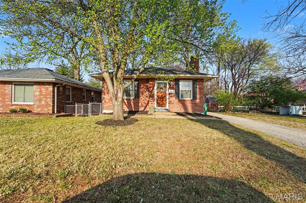Charming all brick Brentwood bungalow is centrally located and full of charm and modern updates! This adorable 2 bedroom, 1 bath home features an open floor plan filled with natural light from large windows in the living room and beautiful hardwood floors throughout. The updated kitchen is sure to impress with 42” cabinets, quartz countertops, gold accents, built-in pantry, and stainless-steel appliances. A separate dining area with fireplace serves as the focal point, creating the perfect space for everyday living. Two spacious bedrooms and fresh hall bathroom complete the main level. The finished lower level offers exceptional additional living space with a large family/recreation room, spacious laundry area, and additional sleeping room, hobby room, or office. Just off the kitchen, the inviting covered back porch is the ideal place to enjoy your morning coffee or unwind at the end of the day while overlooking the huge fenced, level backyard. The outdoor space is perfect for entertaining, family gatherings, or pets, and includes a large patio and storage shed. Private driveway provides convenient off-street parking. This move-in ready home offers the perfect blend of classic charm, thoughtful updates, and functional living space in a desirable Brentwood location!