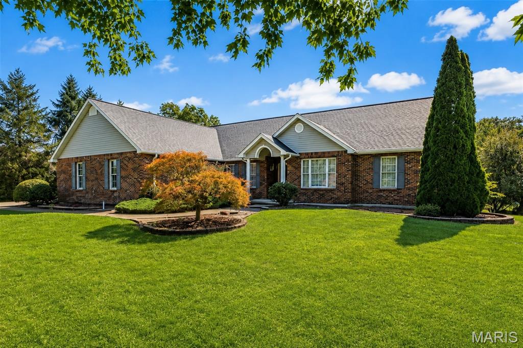 Welcome to 228 Lakeview Drive, a BIG, exceptionally well-built home that has been meticulously maintained and is ready for its next generation! If you've been looking for serious square footage, quality construction, a huge yard, and room to make a home your own, this one deserves your attention.

The main level offers an abundance of living space with 3 bedrooms, 2 baths, a spacious living room, separate dining room, eat-in kitchen and breakfast room, sitting room, sunroom, and convenient main-level laundry. Vaulted ceilings, a masonry fireplace, generous storage, and a large primary suite add to the home's impressive layout.

And then there's the walk-out lower level! You'll find another bedroom, half bath, family and recreation areas, additional storage, and an outstanding woodworking/workshop space. The workshop has both its own interior entrance and direct exterior entrance, and the interior workshop door can be locked—allowing tools and equipment to be securely separated from the rest of the home and helping keep children or others from entering the shop unaccompanied.

This isn't just a corner of the basement with a workbench—it's a fantastic dedicated space for the serious woodworker, craftsman, hobbyist, or anyone who needs substantial workspace. An extensive collection of woodworking machinery, tools, and equipment currently in the shop is also available for separate purchase.

Outside, you'll appreciate the huge yard, covered/enclosed outdoor living areas, garden space, and the neighborhood lake just a short distance away. Property owners have access to the neighborhood lake, adding another great feature to this already unique property. And one major expense has already been taken care of: a brand-new architectural-shingle roof was installed in August 2026!

This home has been incredibly well cared for over the years. While the next owner may choose to make some cosmetic updates, that's where the opportunity lies. Bring your style and imagination and transform an already substantial, quality-built home into something truly spectacular.

Priced at $435,000 with room to update and make it your own, this is a tremendous amount of house for the money. Come see the quality, space, workshop, lake access, and potential for yourself!
