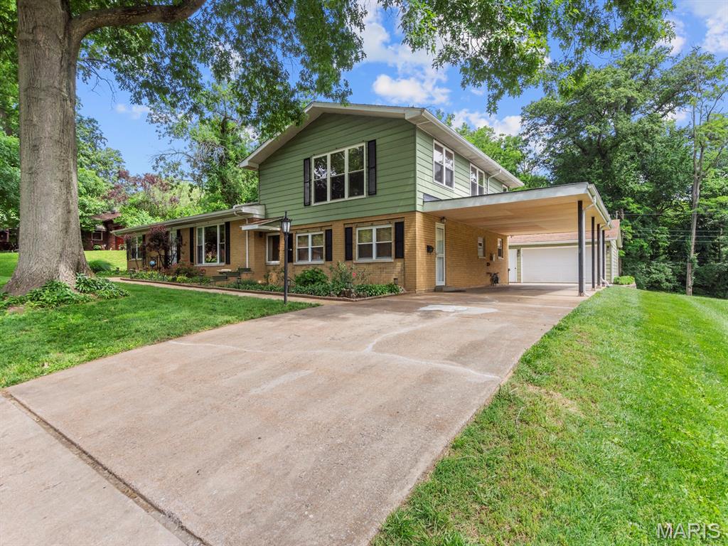 Don't miss your chance to own this fabulous 4-bedroom, 4-bathroom single-family residence in the desirable Northwood Subdivision of Swansea!  With space galore, there is even a possible 5th bedroom with a closet located just outside its doorway.  It has been occupancy approved and offers a little over 3500 square feet of living space  and a .55-acre lot that is park-like and picturesque with nice landscaping and mature trees.
The open-concept kitchen features bamboo flooring, custom oak cabinetry, quartz countertops, a large center island with seating for four and stainless steel appliances. A spacious walk-in pantry provides abundant storage, and the built-in desk area offers the perfect space for a home office or custom coffee bar.
The kitchen opens to a beautiful concrete patio overlooking the backyard complete with pergola and outdoor seating that stay with the home. The adjoining hearth room/dining area features a cozy wood-burning Heatilator fireplace, creating the perfect gathering space year-round.
Designed for comfortable everyday living and effortless entertaining, the home features three spacious gathering areas — two on the main level and an additional living space upstairs. The welcoming entryway great room is filled with natural light from a large picture window, creating a bright and inviting atmosphere.  A second main-floor family room offers exceptional flexibility with ample space for multiple entertainment setups, whether it’s a game table, media area, conversation space, or a combination of all three.
The main floor also includes two bedrooms, highlighted by a spacious primary suite with a recently updated ensuite bathroom featuring a beautifully renovated shower. The main-floor guest bath received a full remodeled with stylish modern finishes in 2023.
The oversized laundry room is both functional and versatile, featuring abundant storage space with washer and dryer included.  It has electircal access for a deep freezer or second refrigerator if adding one is desired.  Just off the laundry area, an additional bonus space is ideal for a hobby room, craft area, folding station, or extra storage. 
The second floor offers an incredible amount of flexible living space. A spacious third living area creates the perfect retreat for a media room, game room, playroom, teen lounge, or private entertainment space. This level also features two additional bedrooms, a dedicated office, and a fourth full bathroom. The office could easily function as a non-conforming fifth bedroom by utilizing the adjacent walk-in hall closet for storage space. Whether you need room for guests, hobbies, working from home, or multi-generational living, the upper level provides the versatility to fit a wide variety of lifestyles.
In addition to the stunning bamboo flooring and beautifully updated kitchen, this home has received several recent improvements throughout. Updates include new block windows in all main-floor bathrooms in 2023, a fully remodeled primary ensuite completed in 2026, a beautifully renovated main-floor guest bathroom completed in 2023, and a new rubber roof installed over the carport in Spring 2025.
Outside, the property continues to impress with exceptional functionality and storage options. In addition to the attached carport for convenient covered parking, the home also features an oversized detached 2-car garage offering ample space for vehicles, tools, hobbies, or workshop potential. A storage shed provides room for lawn equipment, seasonal decor, and outdoor essentials, and completes the home’s beautifully maintained park-like setting.
With generous living space, thoughtful updates, and a stunning setting, this move-in-ready home offers comfort, style and flexibility.  Motivated Sellers will consider all reasonable offers.