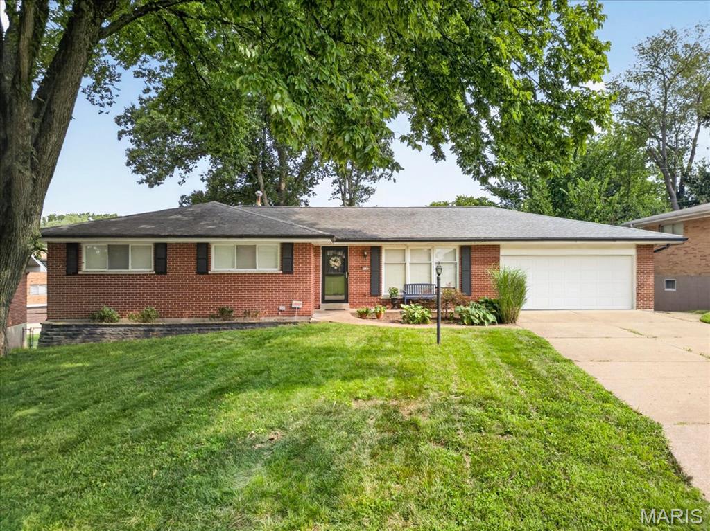 Back on the market, no fault of the Sellers. Great opportunity to own this beautifully updated ranch offering a wonderful combination of traditional charm and today’s finishes. The light-filled living room welcomes you with hardwood flooring, gas fireplace, and a large picture window. The heart of the home is the spacious updated kitchen featuring crisp white cabinetry, quartz-style countertops, subway tile backsplash, stainless appliances, and an impressive center island with seating. The kitchen opens to the dining area, creating an inviting space for everyday living and entertaining. The spacious primary bedroom offers abundant natural light and double closets, while the beautifully updated bath features dual vanities, generous storage and stylish finishes. Three additional bedrooms provide plenty of flexibility for family, guests or a home office. A partially finished lower level adds valuable additional living space. Wet bar, wine cooler and ice maker. One of the home's standout features is the bright sunroom, walls of windows and sliding doors overlooking the backyard—the perfect spot for relaxing or entertaining throughout the seasons. An attached two-car garage completes this move-in-ready home located in the Lindbergh School District. Only minutes to Grant's Trail and Grants Farm. Seller is having a new roof put on before closing. Newer HVAC.