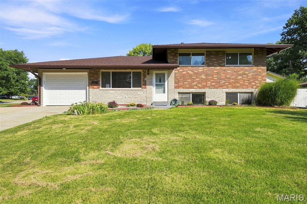 Drive up and fall in love with this home boasting exceptional curb appeal in the highly sought-after Hazelwood West School District! This beautifully updated 4-bedroom, 2.5-bath home with a 1-car garage offers 1,622 square feet of comfortable living space and is truly move-in ready. Major updates include a roof that is only 3 years old, along with an HVAC system and water heater that was updated in 2020, providing added peace of mind for the next owner. As you step inside, you'll immediately notice the fresh neutral paint and beautiful hardwood flooring that create a warm and welcoming atmosphere. The spacious living room provides the perfect setting for relaxing evenings, family movie nights, and entertaining guests. The updated kitchen is sure to impress, featuring modern cabinetry that extends to the ceiling and offers abundant storage space. Recent updates include a newer stove-gas (the seller wants the new owner to know: if you prefer an electric stove, the kitchen is already set up) microwave, dishwasher, and refrigerator, along with updated lighting, ceiling fans, sink, and countertops. Easy-to-maintain laminate flooring adds both style and convenience. The open kitchen and dining area allows you to stay connected with family and guests while preparing meals and entertaining. The upper level offers three generously sized bedrooms, including a primary suite with a convenient
half bath. A full hall bathroom serves the additional bedrooms. The lower level features a spacious fourth bedroom, an updated full bathroom, and a laundry room with plenty of storage space. This level also provides direct access to the backyard, adding flexibility and functionality to the home's
layout. Step outside and enjoy the private patio, perfect for summer barbecues, outdoor gatherings, or relaxing with your morning coffee. Garden enthusiasts will appreciate the established garden beds and beautifully maintained landscaping that enhance both the front and back yards. With updates throughout and pride of ownership evident inside and out, this home is ready for its next owner. Last but not least, the home has passed the Municipal Inspection! Don't miss your chance to make this wonderful property your new home. Schedule your showing today!