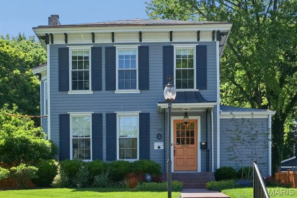 Historic Webster Groves 2-story blends timeless charm with exceptional updates. This 3-bed. 2.5 bath home features a gracious living room/hearth room, formal dining room, main floor laundry, and family room. Ideal for entertaining! Chef's kitchen offers marble countertops, custom cabinetry, center island, Wolf appliances, Bosch dishwasher, and Sub-Zero refrigerator. Highlights include 3 FP, brand new roof (2026), wood floors, vaulted ceiling in the primary suite, plantation shutters, built-in bookcases, bay window, front and rear staircases, and retaining wall (2025), plus newer siding, windows and copper gutters, and 1 new central air unit (2026). Outdoor living features a new concrete patio with hot tub, grill and firepit overlooking the lush level yard with koi pond. Brick driveway, irrigation and security systems, plus newer oversized 2+ car detached garage with 2nd-level bonus room currently being utilized as a golf simulator. Walk to downtown Webster shops/restaurants with easy access to highways and Clayton.