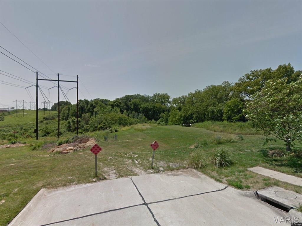 The property outline from St. Louis County is seen in the photos, and the poles do NOT run over the property nor are they on the property line.