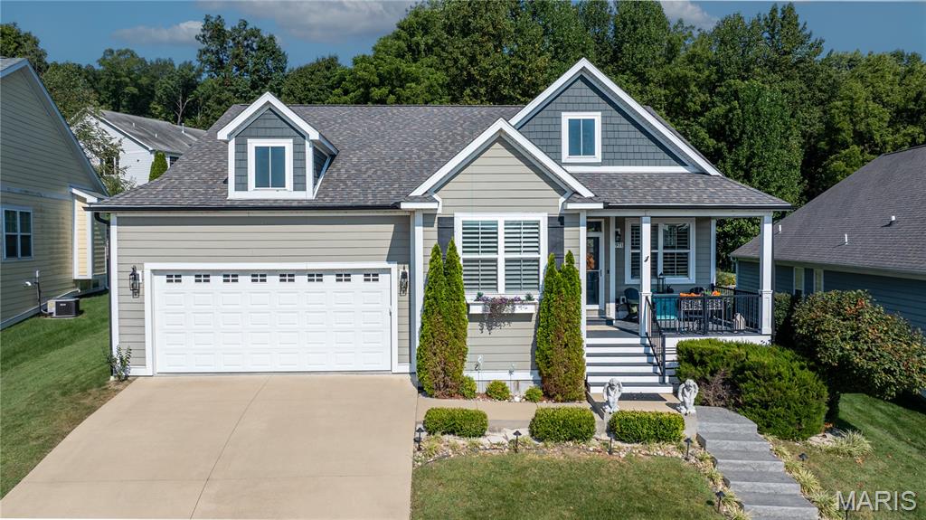 Absolutely charming Craftsman in Walden Park with a rare, private backyard. This move-in-ready, classic stunner blends fresh, modern finishes and lots of natural light. Gorgeous hardwood floors flow throughout the open main level into a dream gourmet kitchen boasting crisp white shaker cabinetry, a massive quartz island with seating, and a sunny dining area. The kitchen seamlessly opens to the bright family room anchored by a gas fireplace. The spacious, main-level owner’s suite features a walk-in closet and spa-like, ensuite bathroom with freestanding tub, oversized tiled shower, and elegant wainscoting. The laundry room is conveniently located on the main floor just outside the master suite, with a sink and lots of cabinet storage space. Entering from the garage reveals a functional mudroom drop zone for shoes, boots, and coats. The fully finished basement delivers two very large bedrooms, a full bath, and bonus living space perfect for a media room, gym, or playroom. Outdoor living shines with a classic covered front porch and large back deck overlooking a lighted, fenced yard (complete with durable metal fencing and irrigation system). As part of the vibrant Walden Park community, you’ll enjoy a resort-style pool, clubhouse, fitness center, playground, plus direct neighborhood access to the scenic La Croix Trail, and surrounding hiking trails — perfect for morning runs, evening strolls, or weekend adventures with the family. Every detail has been thoughtfully curated: designer lighting, on-trend tile, soothing paint colors — this home truly feels like love at first sight.