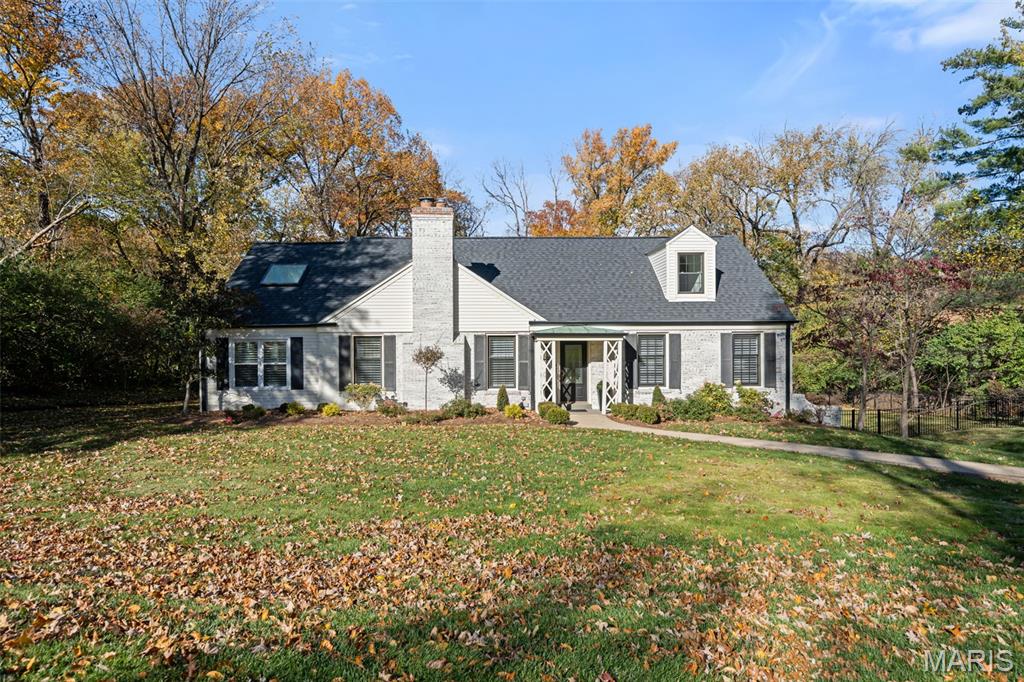 Timeless charm meets modern comfort in this beautifully updated story-and-a-half home situated on nearly a half-acre in the heart of Ladue. The main-floor primary suite offers convenience and luxury with a gorgeous, newly renovated bath. The light-filled kitchen is a standout, featuring a peninsula island, quartz countertops, newer appliances, and a eat-in area. It opens seamlessly to the backyard and covered patio—ideal for effortless entertaining and everyday living.  A gracious formal living room anchors the front of the home, while a vaulted family room provides an airy, inviting retreat. Upstairs you’ll find two oversized bedrooms and a full hall bath. The finished lower level adds flexible living space, along with a dedicated laundry area and a tuck-under two-car garage.  Set on a quiet cul-de-sac in a warm, welcoming neighborhood within the award-winning Ladue School District, this home offers painted white brick, a fully fenced rear yard, and an unbeatable location close to everything. A rare find in one of St. Louis’ most sought-after communities.