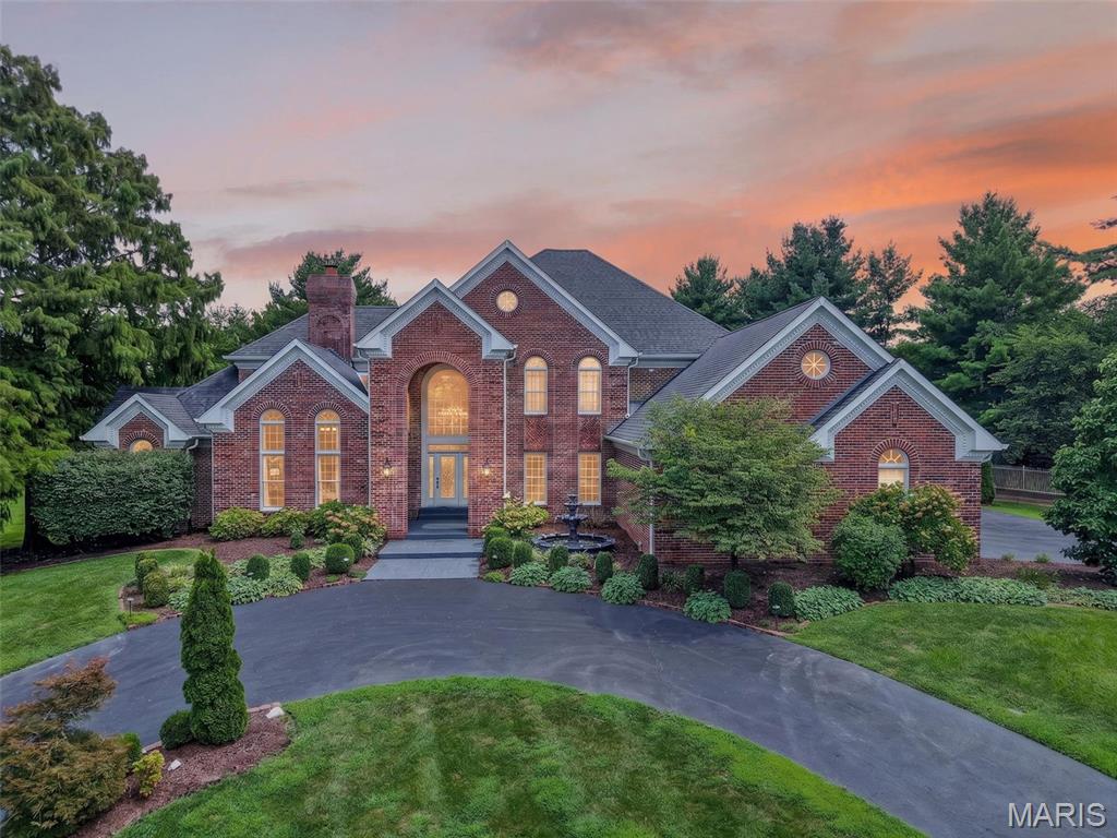 Wow doesn’t quite cover it. Tucked behind the gates of The Hamptons in Town & Country, this estate sits on a private 1.21-acre cul-de-sac lot backing to woods with 7,790 of total living spaces— and it’s better than ever. Soaring 20-ft ceilings and walls of windows flood the foyer and Great Room with light. The chef’s kitchen delivers a center island with prep sink, granite, and Viking appliances including a 48” range plus warming drawer, opening to a breakfast/hearth room built for gathering. The main-floor primary suite is pure luxury: freestanding tub, oversized shower, heated floors. Upstairs, three ensuite bedrooms plus a loft. The finished lower level brings a pub-style bar, theater, gym/rec room, bedroom and full bath. Outside: a private in-ground pool and 4-car garage. Freshly painted throughout with all-new lighting, an updated beverage bar, refreshed powder and guest bath. Parkway West schools and a stones throw from WCA, CBC, Priory, Promise Academy, Visitation and Whitfield. Simply move in.