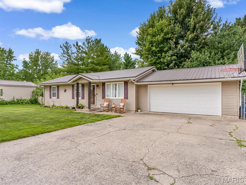Welcome to 1103 Birch Lane in Sparta, Illinois! Situated in a desirable neighborhood, this well-maintained 3-bedroom, 2-bathroom home offers the perfect combination of comfort, functionality, and space to entertain. Step inside to find an inviting main level featuring an updated kitchen with appliances that will remain, a spacious living room anchored by a cozy electric fireplace, and three comfortable bedrooms served by a full bathroom. Step through the sliding glass door onto the back deck, creating the perfect space to enjoy your morning coffee, host summer cookouts, or simply relax while overlooking the fully fenced backyard.
The finished lower level provides exceptional additional living space, complete with a large family room, a full bathroom, a bar area perfect for hosting family and friends, and ample storage space. Recent and notable features include a durable metal roof and a sump pump for added peace of mind.
Whether you're looking for room to grow, space to entertain, or simply a move-in ready home in a great location, 1103 Birch Lane offers a wonderful opportunity to enjoy comfortable living with features today's buyers will appreciate.
