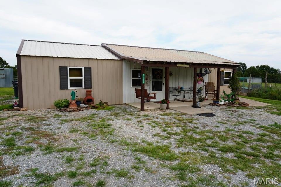 Welcome to your own slice of country paradise! This charming, move-in-ready 2-bedroom, 1-bath home sits on 16.59 picturesque acres, offering the perfect blend of comfort and rural living. Renovated just three years ago, the home features modern updates while maintaining its cozy appeal and comes complete with all appliances. The property is ideal for hobby farming, livestock, or simply enjoying wide-open spaces. It features a spacious pole barn, fenced pasture, a productive hay field, and a beautiful pond that adds to the peaceful setting. Whether you're looking to start a small farm, enjoy recreational land, or escape to the countryside, this property offers endless possibilities. Don't miss this rare opportunity to own a small farm just a couple miles from river access with everything you need to begin your country lifestyle!