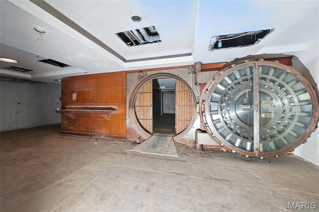 Step Into the Vault: Historic Underground Gem with Limitless Creative Potential!!!

Beneath the historic Marquette Building, once home to Boatmen’s Bank, lies a commercial space unlike any other. This lower-level vault area preserves the drama and dignity of early 1900s banking—starting with its colossal round steel vault door, complete with bars and a secondary entrance.

Unrenovated, raw, and mesmerizing, the space drips with historic energy. Echoes of high finance and guarded fortunes linger in every corner—yet its future is entirely open to interpretation. Imagine candlelit wine tastings in the vault, an artful speakeasy behind the steel, or an underground gallery or private club accessible by elevator. There's luxury in its silence, and vision in its bones.

Offering over 3,700 SF with Broadway entrance access, a fire suppression system, and endless character, this space may be purchased alone or bundled with the 9,400 SF first-floor office above. The vault is ready for its next story—perhaps yours!!!