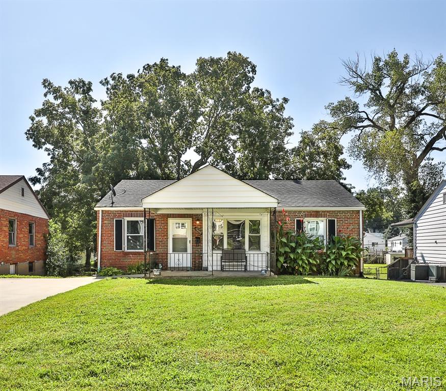 OPPORTUNITY is knocking! Seller is providing a clear municipality inspection for immediate occupancy. This adorable brick home w/covered front porch initially greets you with a spacious dining room & living room, ceiling fan, & large picture window. The awesome eat in kitchen has tons of counter space, cabinet storage, wainscoting, large window overlooking backyard, pantry, gas range, built in microwave & dishwasher.  2 generous sized bedrooms w/ceiling fans, a beautiful full hall bath (2022), hall linen closet, attic fan, & thermal windows (2012) complete main floor. Lower level offers even more living space, with a huge rec room, sleeping room w/closet & a full bathroom (2010) w/walk in shower. Outside, enjoy the composite deck & fully fenced backyard. A double wide concrete entry driveway (2021), leading to nice 1 car garage w/electric door opener, & attached storage area behind it. Great location, near schools, Tiemeyer Park, shopping & public transportation. Frig not included.