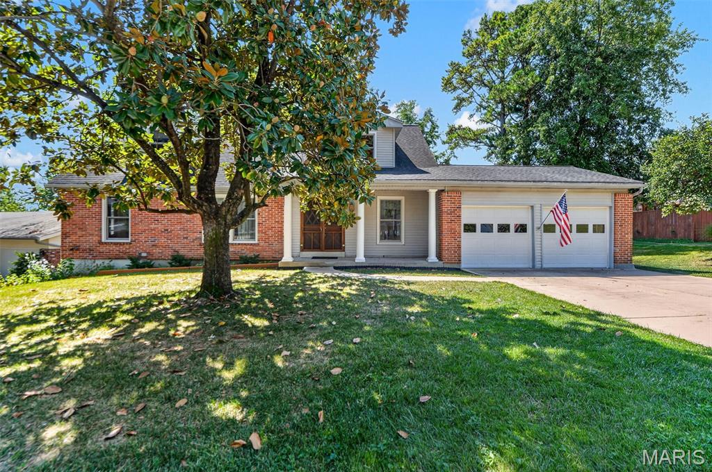 Spacious 1.5-story in one of the hottest places to live- Ballwin! This amazing find offers nearly 3,300 total square feet across three finished levels. The primary bedroom is on the main floor with a private ensuite bath and double glass doors leading directly to the newer deck, overlooking a private yard near the neighborhood's fishing lake with a partial lake view. A second main-floor room could serve your individual needs as either a bedroom or, as currently shown, a den with windows on three sides and built-in shelving; it works well as a home office, guest room, or in-law space for multi-generational living. Upstairs are two more spacious bedrooms, one with its own ensuite bath, under a vaulted tongue-and-groove ceiling with skylights. 

The walk-out lower level is mostly finished with a rec room, family room, utility room and full bathroom, adding a third living level for a media room, gym, or additional guest space. The covered front porch, deck, and lower-level patio provide three separate outdoor living spaces. Newer roof, high-efficiency furnace, insulated windows, gas fireplace, and an attached 2 car garage round out the feature list.

Neighborhood amenities include a clubhouse, pool, and fishing lake, all within the Parkway School District and close to Ballwin's parks, trails, shopping, and restaurants. Original finishes throughout, well-maintained and ready for your updates.