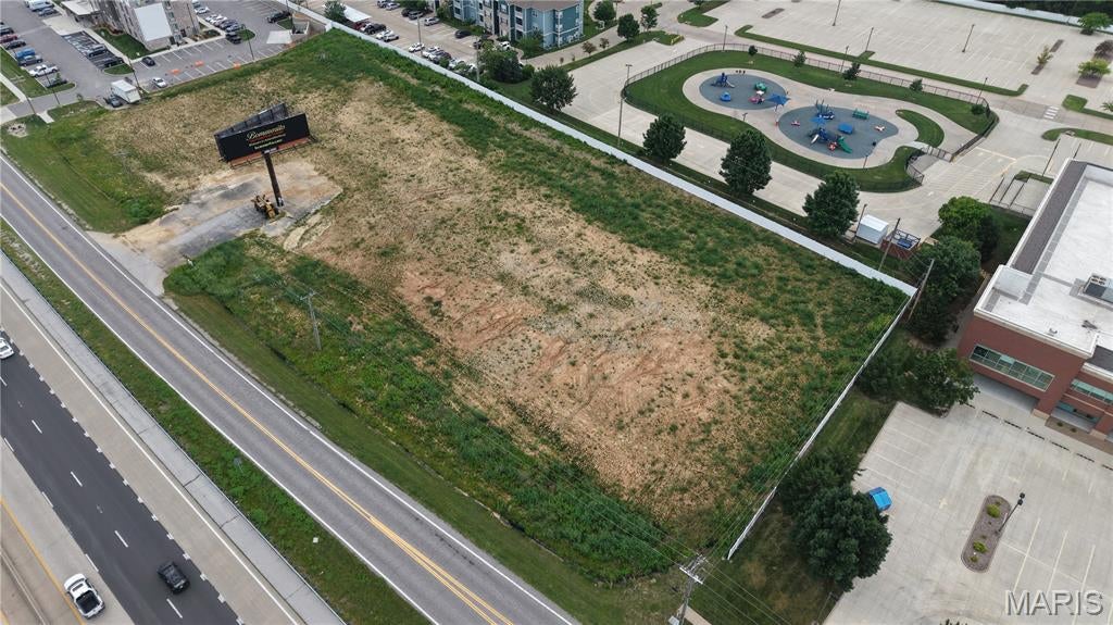 This 2.843-acre tract in St. Peters offers a prime location along Veterans Memorial Parkway with immediate proximity to I-70 and major commercial corridors. The site is predominantly level and ready for development, featuring approximately 117,360 usable square feet after easement adjustments. Current site improvements include a steel-framed highway billboard with dedicated access. The property benefits from strong visibility and accessibility, presenting a valuable opportunity for retail, service, or mixed-use development within a dynamic commercial zone.