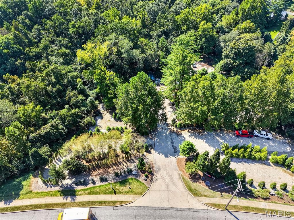 A beautifully partially wooded 7.63-acre retreat along Clayton Road, offering a peaceful blend of gentle terrain, natural privacy, and a meandering creek that brings movement and life to the landscape. This property feels tucked away yet wonderfully connected to everything close at hand, with elevated areas that create inviting possibilities for a future homesite surrounded by mature trees and quiet views. Zoned Non-Urban for unrestricted living, the land sits among established residential settings on nearby ridges, giving it a sense of place while still feeling like your own private escape. The creek adds charm and character to the southern portion of the acreage, creating a serene backdrop for nature lovers. ******For buyers seeking an even grander vision, the adjoining 18.36-acre ridge parcel to the east (MLS #26028269) may also be purchased, creating a breathtaking combined estate of 26 acres. Together, these properties form an extraordinary setting for a private compound or an inspired detached-villa community nestled in nature, with rolling elevations, wooded privacy, and a sense of serenity that’s increasingly rare along Clayton Road. The two parcels complement each other beautifully, offering expansive possibilities for those who dream big and build with intention. - Both properties are Zoned Non Urban